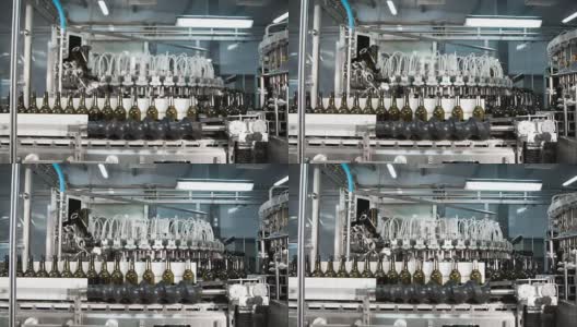 啤酒厂的自动啤酒灌装机。高清在线视频素材下载