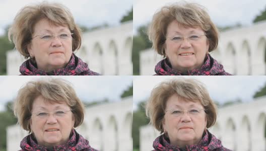 户外微笑的60岁成年妇女肖像高清在线视频素材下载