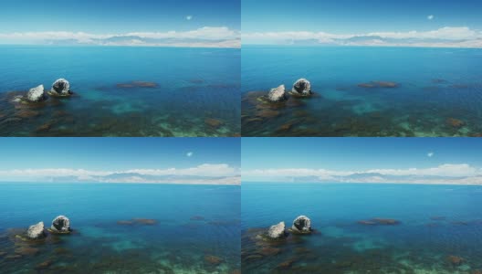 美丽的景观与岩石在透明的蓝色海洋高清在线视频素材下载