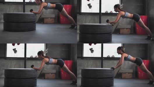 亚洲年轻的运动女性做腹肌锻炼在健身房进行交替身体提升和平板支撑锻炼。高清在线视频素材下载