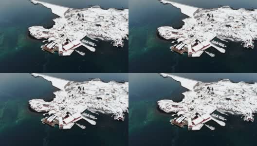 挪威罗浮敦群岛海岸线上白雪覆盖的渔村高清在线视频素材下载