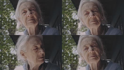老年痴呆的老奶奶看着相机，老奶奶，特写肖像系列。高清在线视频素材下载