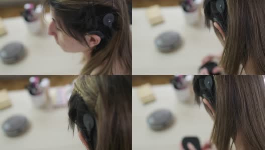 年轻女子在家植入了耳蜗高清在线视频素材下载
