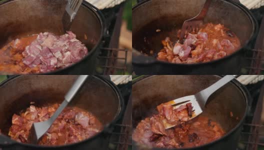 在大铁锅里准备菜，用红洋葱和肉等组成高清在线视频素材下载