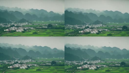 喀斯特山峰森林(万峰林)的村庄和稻田，贵州，中国。高清在线视频素材下载