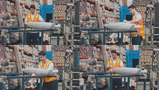 澳大利亚男工人在仓库用塑料包装地毯高清在线视频素材下载