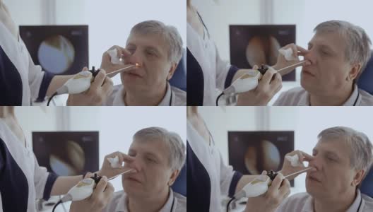 医生用耳鼻喉镜检查病人的鼻子高清在线视频素材下载