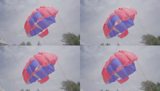 泰国普吉岛卡伦海滩上的彩色降落伞高清在线视频素材下载