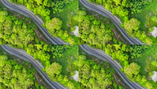 4K鸟瞰图道路与汽车周围许多树木在森林高清在线视频素材下载