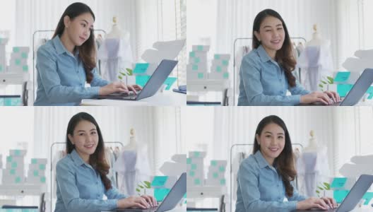 肖像年轻迷人的亚洲女企业主创业看相机工作开心用盒子在家准备包裹快递中小企业供应链，采购，全渠道商务在线概念。高清在线视频素材下载