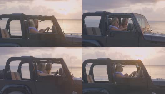 女性朋友们逃到田园诗般的海滩。透过SUV车窗看。田园诗般的日落高清在线视频素材下载