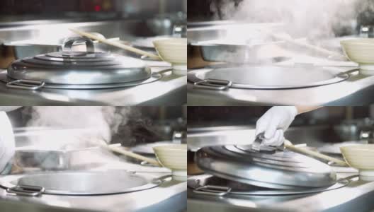 手在厨房打开锅盖的慢动作高清在线视频素材下载
