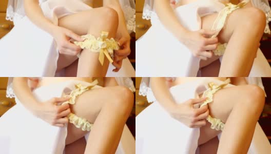 穿着婚纱的新娘戴着吊袜带高清在线视频素材下载