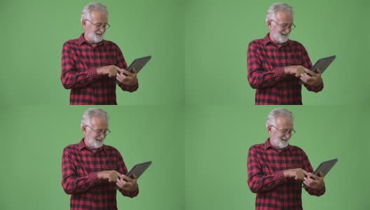 绿色背景下英俊的长胡子老人高清在线视频素材下载