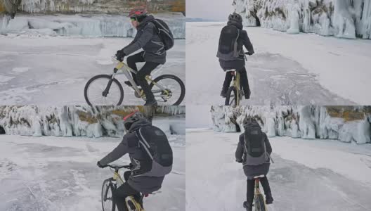 一个人在冰洞附近骑自行车。有冰洞和冰柱的岩石非常漂亮。骑自行车的人穿着灰色羽绒服，背包和头盔。旅行者正在骑自行车。高清在线视频素材下载