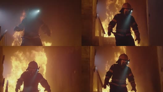 勇敢的消防员在头盔上打开手电筒跑下燃烧的楼梯。火是激烈的。在缓慢的运动。高清在线视频素材下载