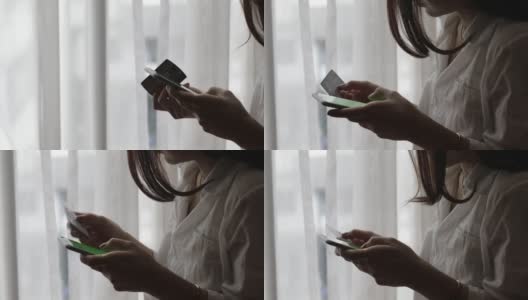 年轻女子使用智能手机和信用卡进行网上银行高清在线视频素材下载