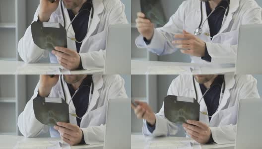 医生通过x光检查鼻骨，用手机与病人交谈高清在线视频素材下载