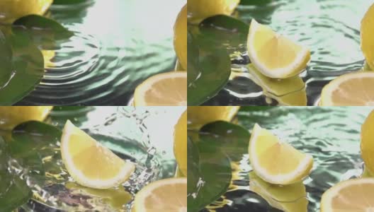 柠檬片碰到淡水表面。慢动作镜头高清在线视频素材下载