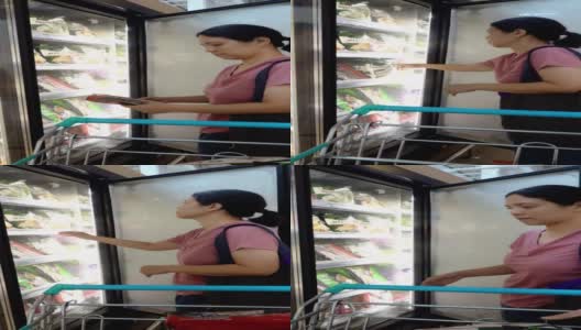亚洲成熟女性在杂货店购物，用可重复使用的购物袋高清在线视频素材下载
