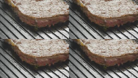在烤架上烤美味多汁的肉排高清在线视频素材下载