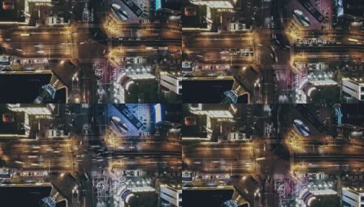 T/L WS PAN无人机在夜间城市街道十字路口的视角高清在线视频素材下载