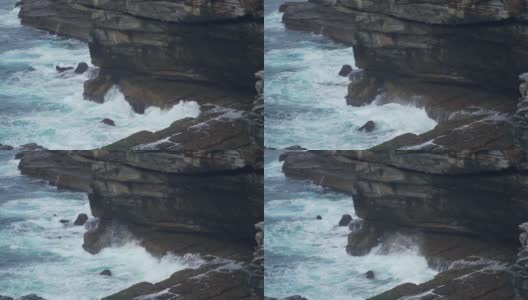 慢动作的海浪击中海岸附近的岩石高清在线视频素材下载