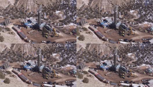无人机拍摄的一个石油和天然气钻井基地在一个冬天在一个晴朗的日子高清在线视频素材下载