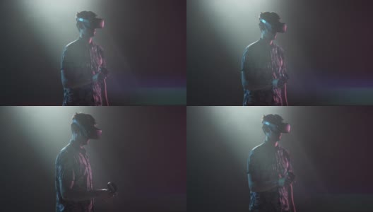 男性玩家在VR头盔中环顾四周高清在线视频素材下载