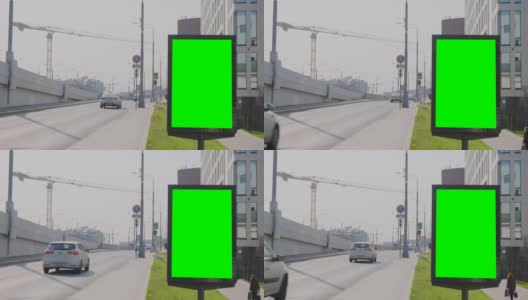 位于ul的绿色屏幕广告牌。附近有一座公路桥，汽车可以在上面行驶高清在线视频素材下载