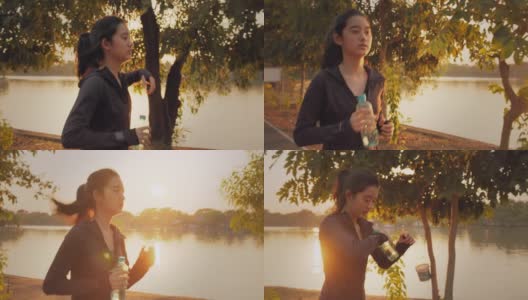 迷人的亚洲少女在公园里跑步。年轻女子晨跑锻炼。高清在线视频素材下载