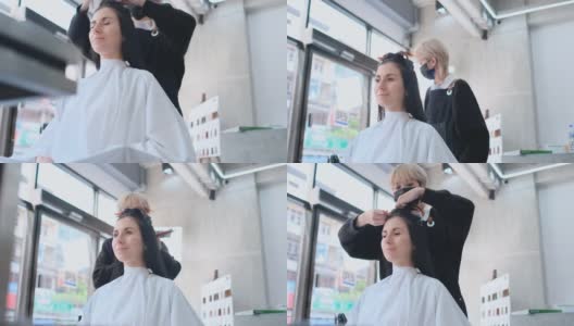 亚洲美容院的女理发师在白天用轻松愉快的心情为白种顾客梳理头发高清在线视频素材下载
