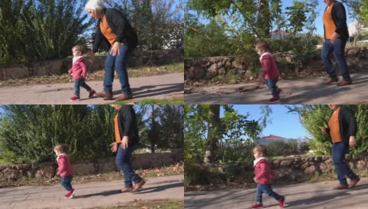 小女孩和老奶奶在公园里散步高清在线视频素材下载