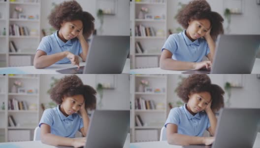 无聊的学生在网上做运动，在家里用笔记本电脑打字，隔离高清在线视频素材下载