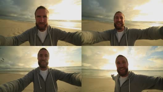 日落时分，大胡子男子在海滩上自拍高清在线视频素材下载