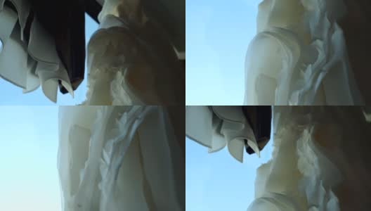 挂在窗前的婚纱和西服高清在线视频素材下载
