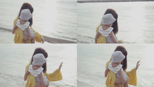 亚洲母亲与孩子在海滩上高清在线视频素材下载