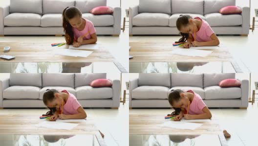 漂亮的小女孩在家里画画高清在线视频素材下载