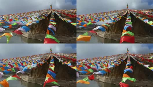 中国四川省甘孜市雅尔琴阁祈祷旗行高清在线视频素材下载