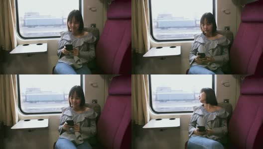美丽的女人在火车上使用智能手机高清在线视频素材下载
