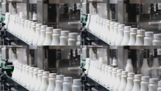 白色塑料奶瓶的连续镜头在生产线上分拣和前进的包装高清在线视频素材下载