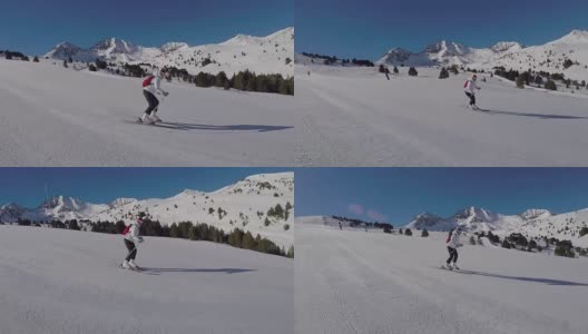 女人们在雪坡上滑雪，阳光照耀着雪山。高清在线视频素材下载