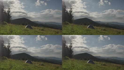 旅游帐篷在山上，风吹动草高清在线视频素材下载