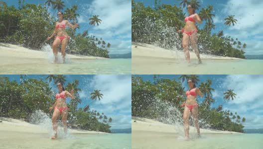 慢镜头特写:欢快的年轻女子在热带异国情调的岛屿海滩上奔跑高清在线视频素材下载