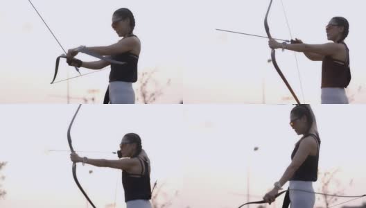 特写迷人的亚洲女性练习射箭在靶场。高清在线视频素材下载