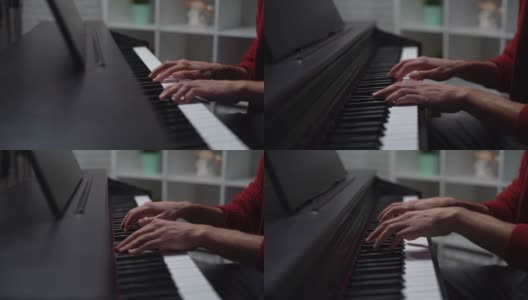 近距离的手，不认识的人在数字钢琴上演奏在家庭录音工作室。高清在线视频素材下载
