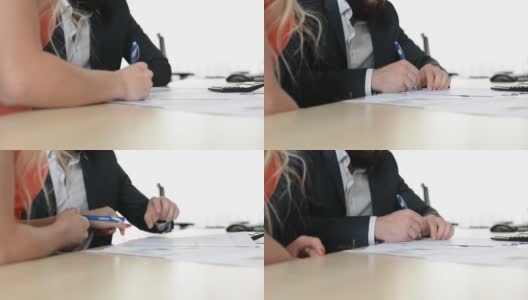夫妻(男人和女人)在办公室签合同-特写手高清在线视频素材下载