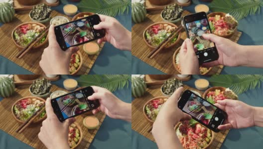 用智能手机特写拍摄夏威夷戳碗。由切成片的蔬菜、海鲜和绿叶植物制成的熟戳。健康的素食。亚洲素食生食，筷子高清在线视频素材下载