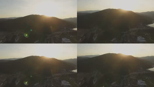 鸟瞰图。在夕阳中飞过美丽的群山。航空摄影机镜头。景观全景。乌克兰,喀尔巴阡山山脉。Bukovel高清在线视频素材下载