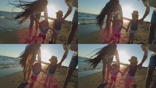 《日落海滩上的幸福家庭高清在线视频素材下载